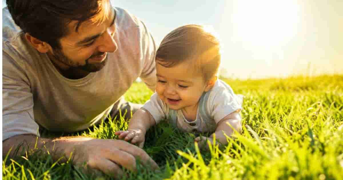 Father and Baby is playing in Umm Al Seneem Park