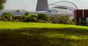 Aspire Park green lawn with Aspire Tower and Khalifa Stadium in the background